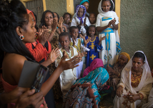 Women clapping during an orthodox wedding ceremony, Afar region, Assaita, Ethiopia