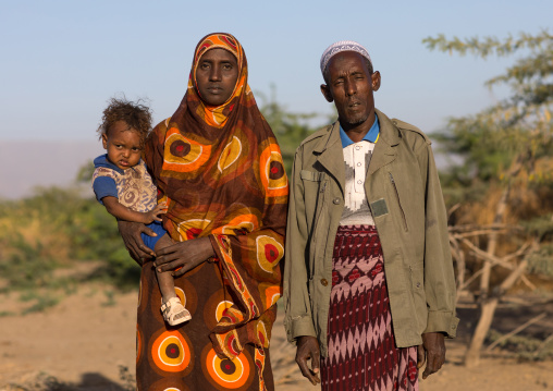 Afar tribe man with his wife and child, Afar region, Afambo, Ethiopia