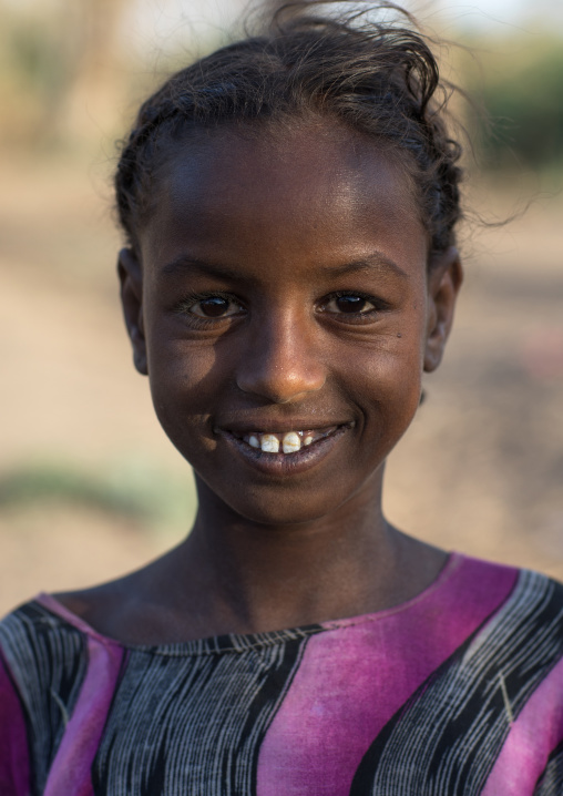 Portrait of a smiling Afar tribe child girl, Afar region, Afambo, Ethiopia
