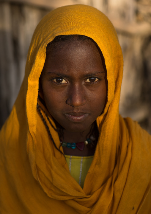 Portrait of an Afar tribe girl with a yellow veil, Afar region, Afambo, Ethiopia
