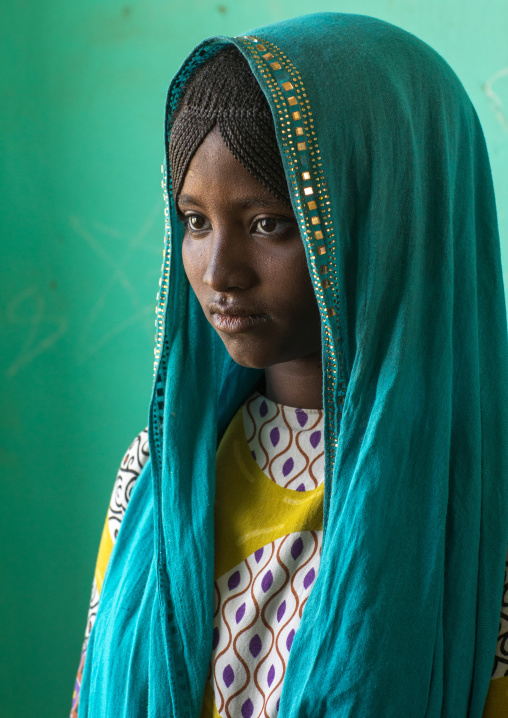 Portrait of an Afar tribe girl with braided hair and a blue veil, Afar region, Semera, Ethiopia