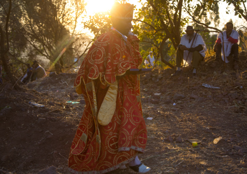 Orthodox priest in the sunset during Timkat epiphany festival, Amhara region, Lalibela, Ethiopia