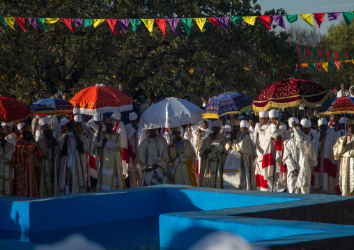 Priests in front of the pool during Timkat celebrations of epiphany, Amhara region, Lalibela, Ethiopia