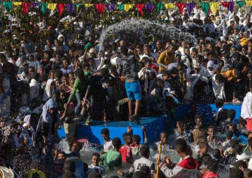 Holy water sprayed onto the crowd attending Timkat celebrations of epiphany, Amhara region, Lalibela, Ethiopia