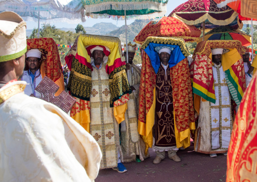 Ethiopian priests carrying some covered tabots on their heads during Timkat epiphany festival, Amhara region, Lalibela, Ethiopia
