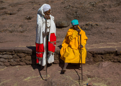 Pilgrim with a monk woman in a rock church, Amhara region, Lalibela, Ethiopia