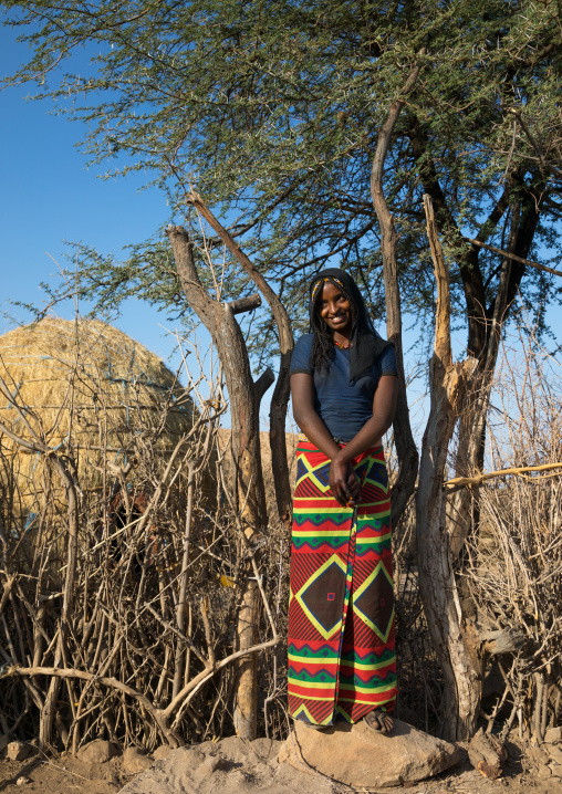 Portrait of an Afar tribe girl in front of her hut, Afar region, Chifra, Ethiopia