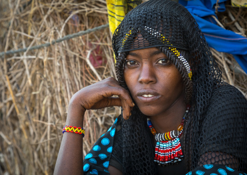 Portrait of an Afar tribe woman with a black veil and a beaded necklace, Afar region, Chifra, Ethiopia