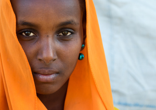Portrait of an Oromo woman in orange veil, Amhara region, Senbete, Ethiopia