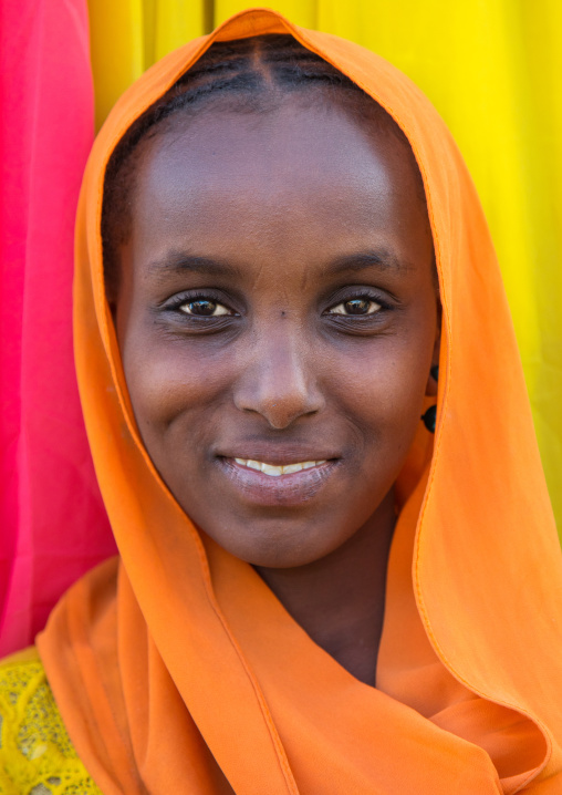 Portrait of an Oromo woman in orange veil, Amhara region, Senbete, Ethiopia
