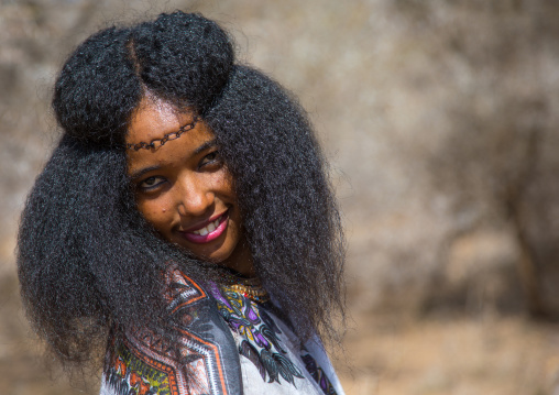 Portrait of a smiling Borana tribe woman during the Gada system ceremony in Borana tribe, Oromia, Yabelo, Ethiopia