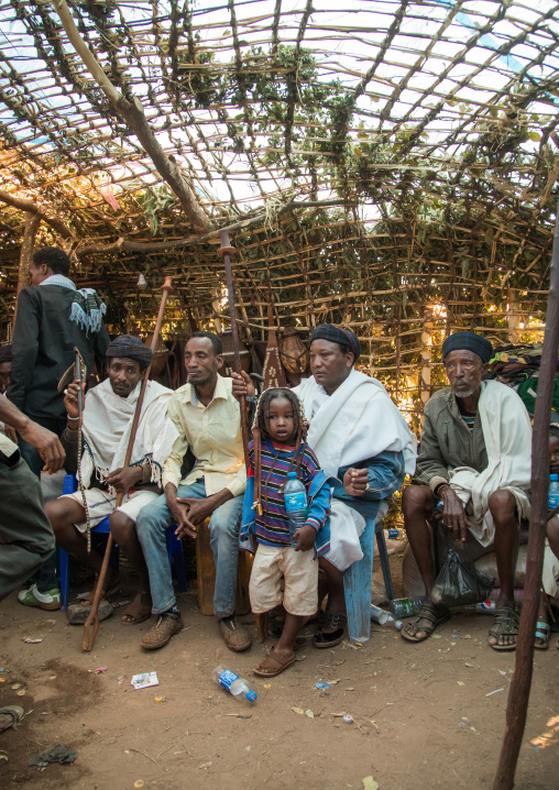 Men inside a traditional hut during the Gada system ceremony in Borana tribe, Oromia, Yabelo, Ethiopia