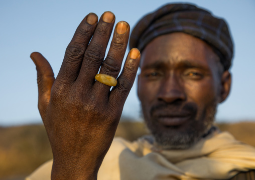 Borana tribe man showing his ring during the Gada system ceremony, Oromia, Yabelo, Ethiopia