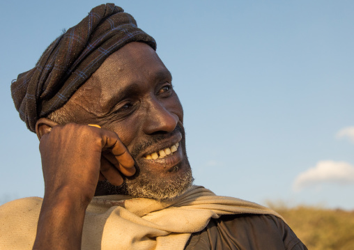 Borana tribe man smiling during the Gada system ceremony, Oromia, Yabelo, Ethiopia
