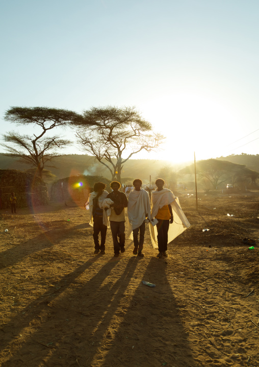 Men walking in the early morning during the Gada system ceremony in Borana tribe, Oromia, Yabelo, Ethiopia