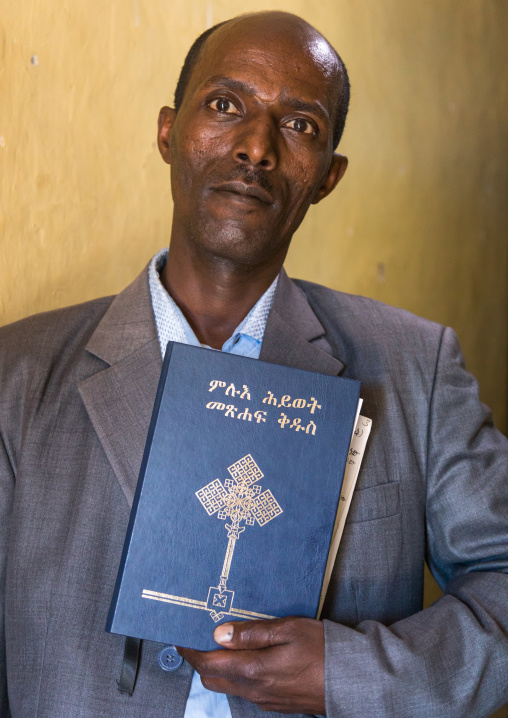 Evangelist pastor Zaid who converted from islam to christianity holding a bible, Addis Ababa region, Addis Ababa, Ethiopia