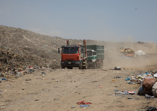 Trucks in Koshe rubbish dump, Addis Ababa region, Addis Ababa, Ethiopia