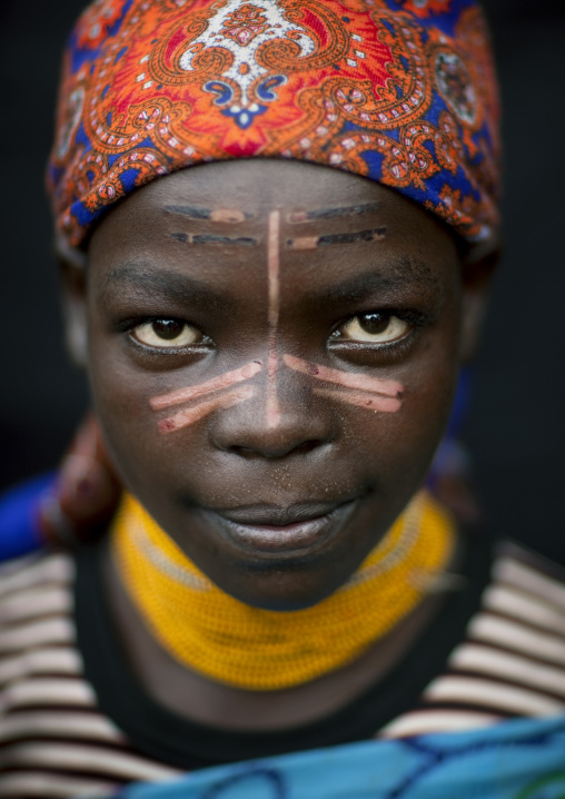 Menit girl with fresh scars on the face, Tum market, Omo valley, Ethiopia
