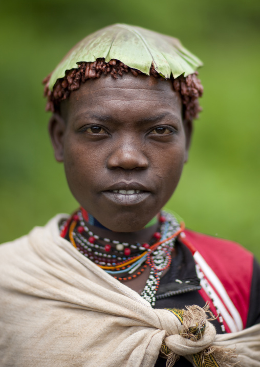 Menit woman with a tree leaf on the head, Tum market, Omo valley, Ethiopia