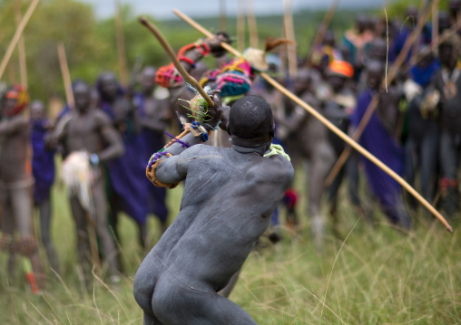 Suri tribe warriors fighting during a donga stick ritual, Omo valley, Tulgit, Ethiopia