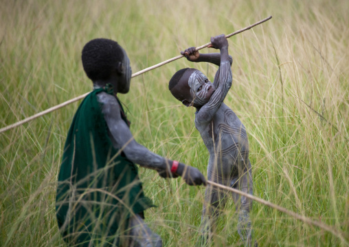 Suri Boys Imitating The Adult Warriors, Omo Valley, Ethiopia