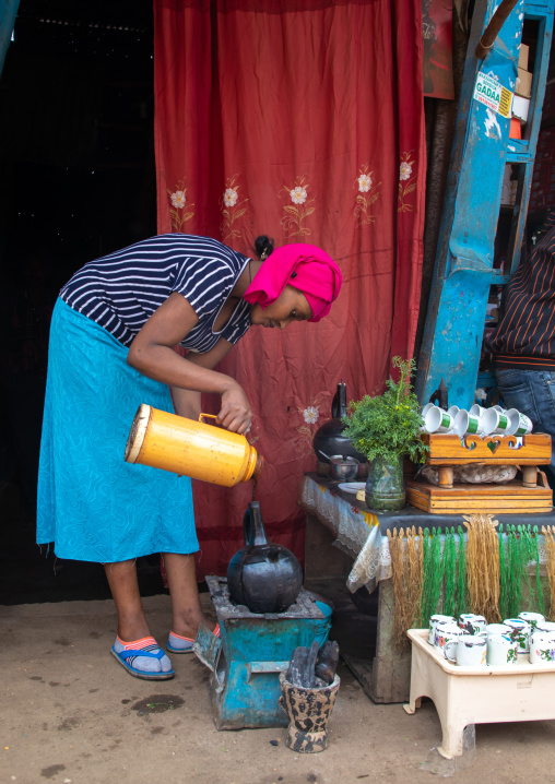 Ethiopian woman preparing coffee in a bar, Harari region, Harar, Ethiopia