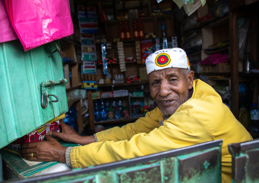 Old ethiopian man in his shop, Harari region, Harar, Ethiopia