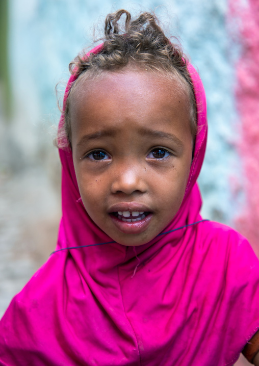 Ethiopian girl with a pink veil and blonde hair, Harari region, Harar, Ethiopia