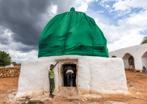 Oromo pilgrims children in front of a shrine with green dome, Oromia, Sheik Hussein, Ethiopia