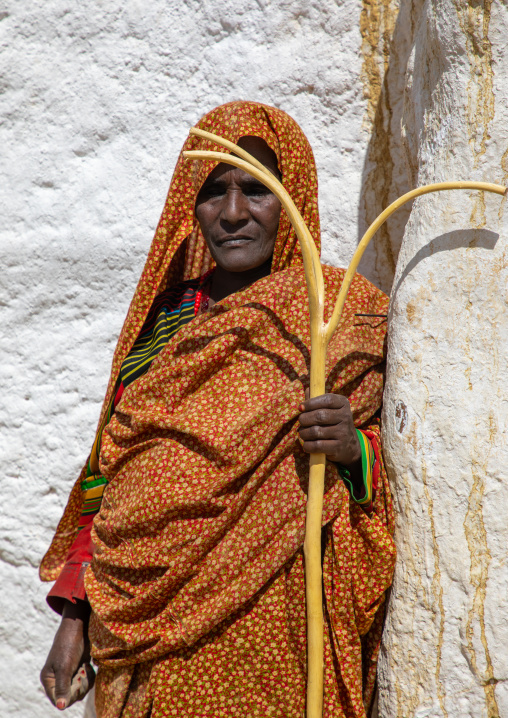 Oromo pilgrim woman in Sheikh Hussein shrine with the forked stick of Hussein , Oromia, Sheik Hussein, Ethiopia