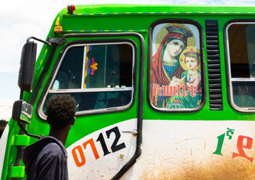 Bus decorated with virgin mary christian icon bringing muslim pilgrims, Oromia, Sheik Hussein, Ethiopia