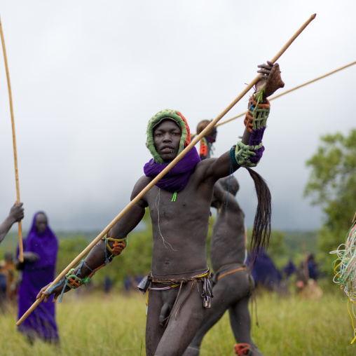 Suri tribe warriors fighting during a donga stick ritual, Omo valley, Tulgit, Ethiopia