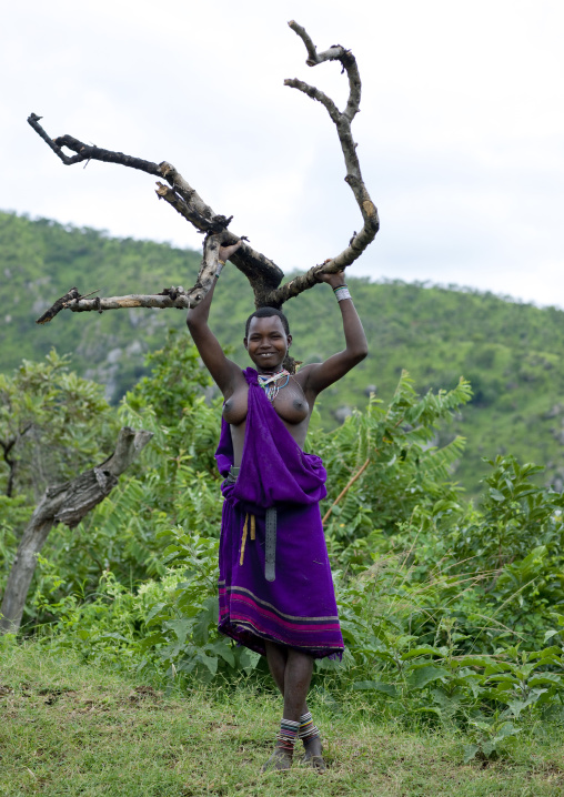 Surma Woman Carrying Tree Branches, Omo Valley, Ethiopia