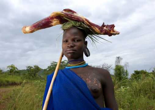 Surma Woman Carrying Meat On Her Head, Ethiopia