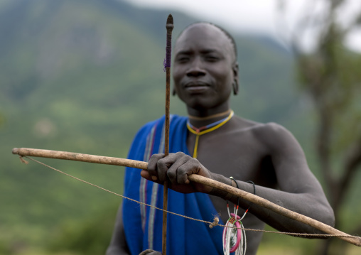 Suri Man With A Bow And Arrow For The Blood Meal Ritual, Turgit Village, Omo Valley, Ethiopia