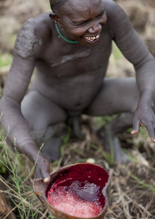 Suri Man Drinking Fresh Cow Blood, Turgit Village, Omo Valley, Ethiopia
