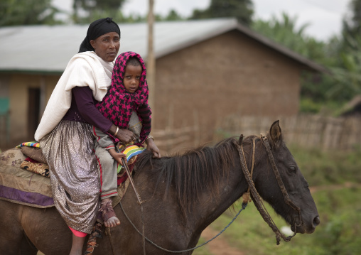 Mother and child on a horse, Ethiopia