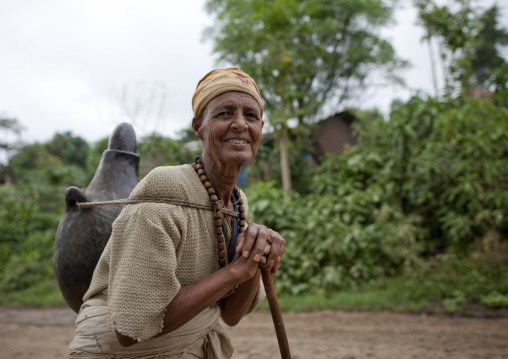Wollo nun carrying a jar on her back, Ethiopia