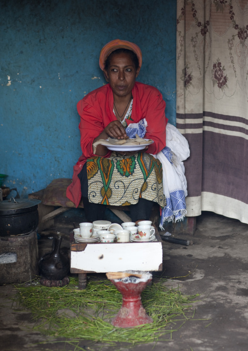 Miss weshi eating injera during the coffee ceremony, Mojo market place, Ethiopia