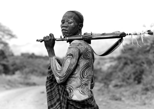 Suri Man With Body Decoration And A Kalashnikov, Turgit Village, Omo Valley, Ethiopia