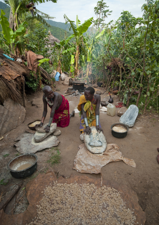 Surma Women Grinding Grain, Turgit Village, Omo Valley, Ethiopia