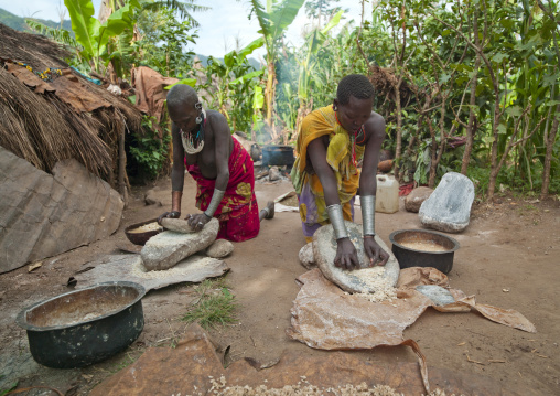 Surma Women Grinding Grain, Turgit Village, Omo Valley, Ethiopia