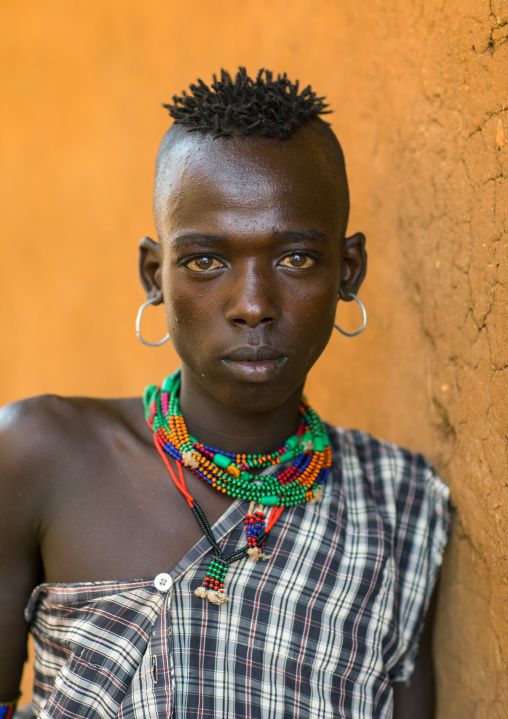 Portrait of a Hamer tribe teenage boy, Omo valley, Turmi, Ethiopia