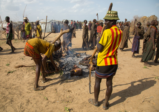 Tribe people cooking a cowduring the proud ox ceremony in the Dassanech tribe, Turkana County, Omorate, Ethiopia