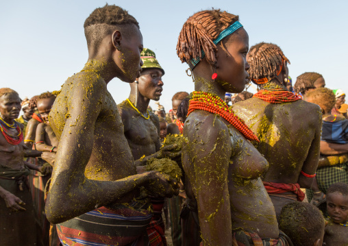 People covering themselves with cow dungs during the proud ox ceremony in the Dassanech tribe, Turkana County, Omorate, Ethiopia