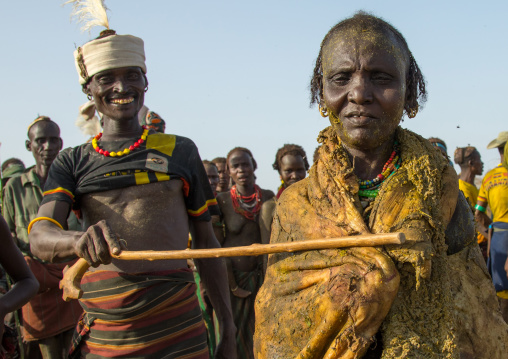 Old woman covering herself with the stomach of a cow during the proud ox ceremony in the Dassanech tribe, Turkana County, Omorate, Ethiopia