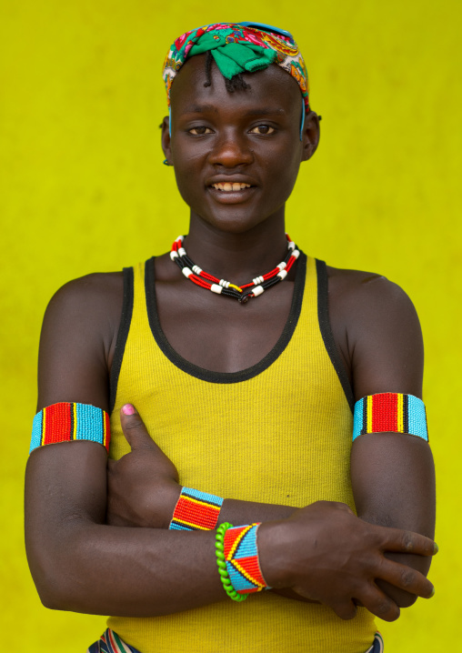 Portrait of a Bana tribe young man with a yellow shirt, Omo valley, Key Afer, Ethiopia