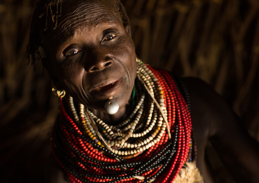 Nyangatom tribe woman with a huge necklace, Omo Valley, Kangate, Ethiopia