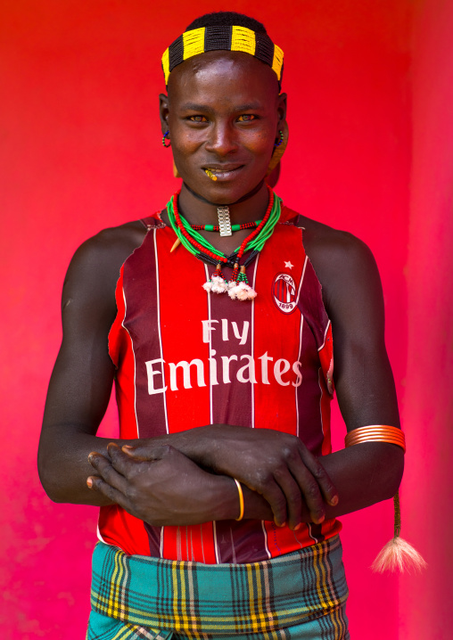 Hamer tribe man wearing a AC Milan football shirt, Omo valley, Dimeka, Ethiopia