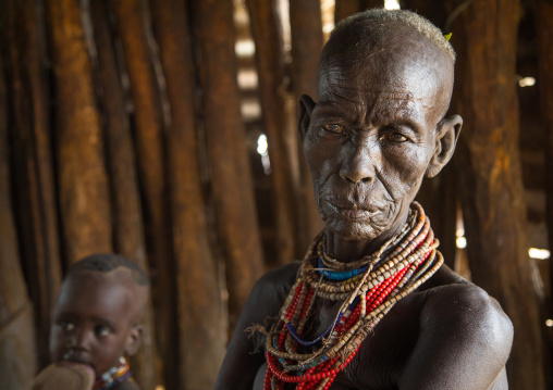 Mrs Moko who had to kill ten children she had before her wedding and who were mingis, Omo valley, Korcho, Ethiopia